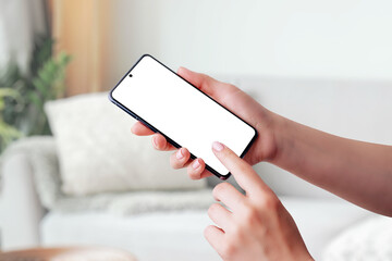 Hand holding smartphone mockup and touching screen