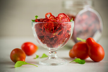 a handful of dried tomatoes and fresh tomatoes