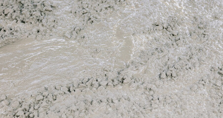 Concrete mix at a construction site as a background.