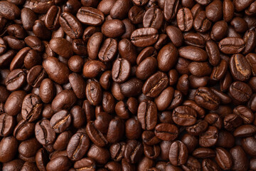 Close up of group black coffee beans. Strong black espresso, Grounds of coffee background, texture