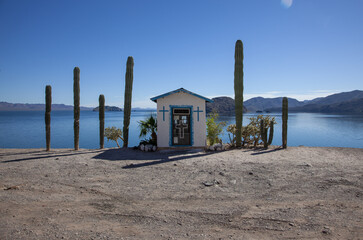 beautiful small church, ocean view in the desert, cactus, island, blue sky, mexico, baja california