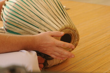 Hands playing musical instrument - Indian drum Mridangam