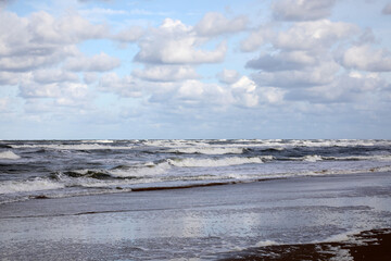 Stormy weather at the sea with clouds and waves