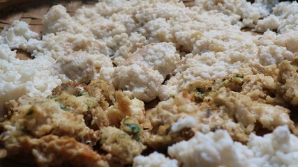 Dried stale rice. stale rice that is dried in the sun. stale rice for fodder.