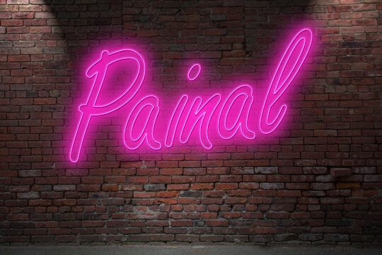 Neon Painal lettering on Brick Wall at night