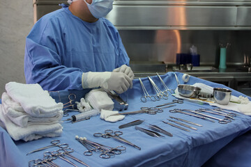 Instrumentalist nurse preparing the medical instruments for the operation.
