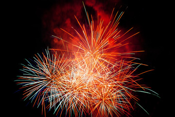 Sky with colorful firework blast launched by the beach