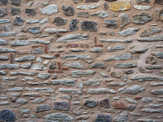 old wall of untreated stone, natural material