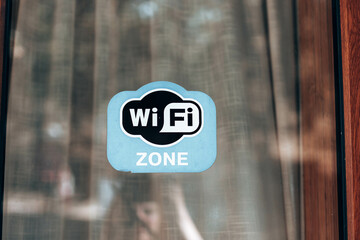 Free wifi sign at the window shop or hotel. Internet service