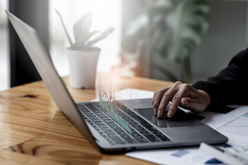 Close up of Business woman accountant or financial expert coins double exposure analyze business report graph finance chart corporate finance economy banking business stock market research concept.