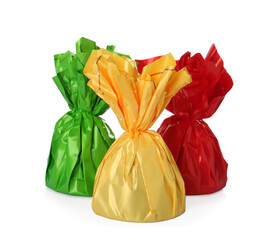 Delicious candies in colorful wrappers on white background