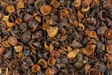  dried rose hip fruit background. Herbs and food ingredients.