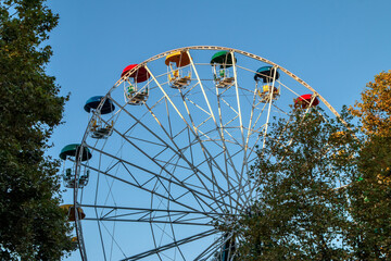 Ferris wheel with multi-colored booths