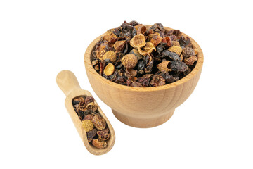 dried rose hip fruit in wooden bowl and scoop isolated on white background. Herbs and food ingredients.