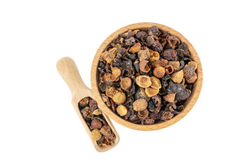 dried rose hip fruit in wooden bowl and scoop isolated on white background. Herbs and food ingredients.