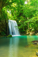 beautiful waterfall A beautiful waterfall in a green forest at Kanchanaburi, Thailand. © banjongseal324