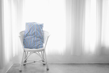 Vintage one armchair against white wall and big window with curtain. Alone and relax rest concept. copy space for text.