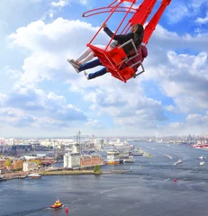 Gardinen People on red seesaw swinging high in the air space against beautiful blue sky above the town. Amsterdam. Netherlands. Inspiration, love and dreams © Alexey Protasov