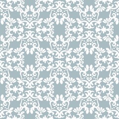White ornament on light blue background. Floral damask seamless pattern. Vector winter background. For fabric, wallpaper or packaging.