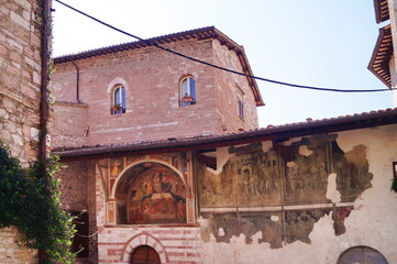 Frescoes on the outer wall of the church of San Leonardo in Assisi, Italy