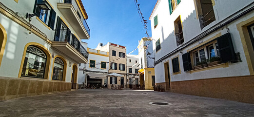 View of the village "Es Migjorn Gran", Menorca, Balearic Islands, Spain, with festoons and plants