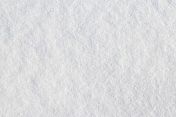 Uniform snow cover. Snow texture on a flat plot of land