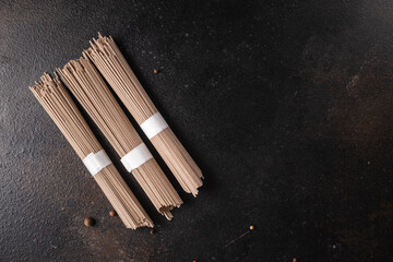 soba noodles buckwheat raw udon noodle ready to cook meal snack on the table copy space food background 