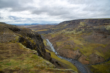 Fototapeta na wymiar Vast Iceland landscape with dramatic clouds and river