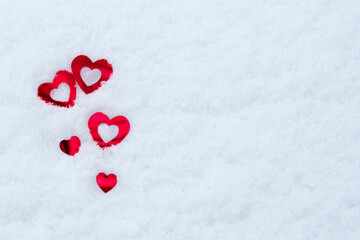 on white snow red hearts. Valentine's Day concept. Copy space. Valentine