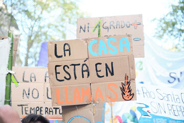 Sign text: the house is on fire. Mass demonstration, Global Climate Strike