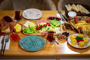 Rich traditional Turkish breakfast on table background