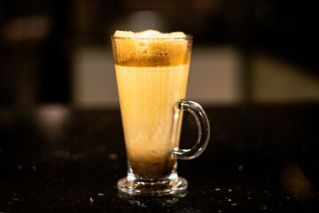 Cold Frappe coffee on dark table