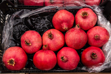 ripe pomegranate in a box.