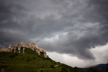 Fototapeta na wymiar storm clouds over the castle on a hill slovakia