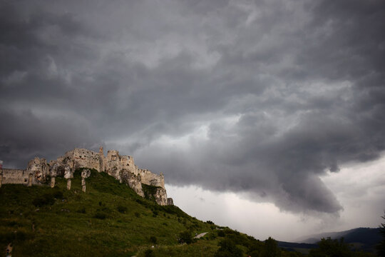 storm clouds over the castle on a hill slovakia