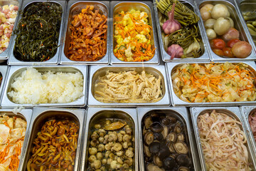 Pickled vegetables on self service restaurant counter or shop counter