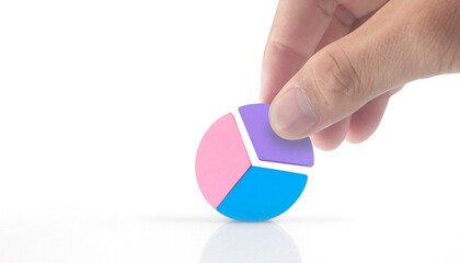 Business connecting piece of multi colored pie wood chart in hand