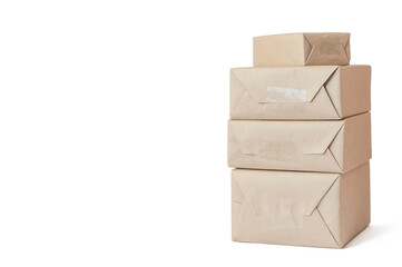 stack of craft wrapped boxes for deliveryon white background. High quality photo