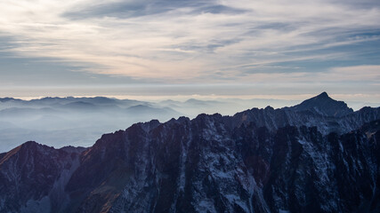 Naklejka na ściany i meble Sunset over iconic peaks of High Tatras mountains national park in Slovakia