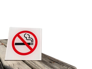 No smoking sign placed on old wooden table, isolated on white background, copy space