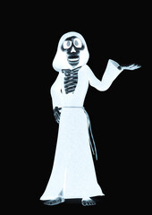 funny skeleton in cloak is demonstrating