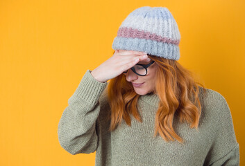 Shame. Close up young woman covering face with hands, isolated on yellow background. Oops. Ashamed...