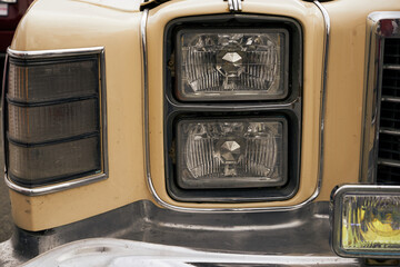 An image of a headlight of an old car.