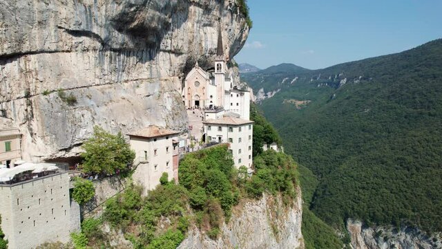 Aerial view of people exploring Santuario de la Madonna della Corona in Italy
