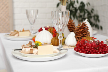 Table set with beautiful autumn decor for festive dinner