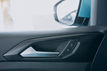 Details of a car standing in car showroom