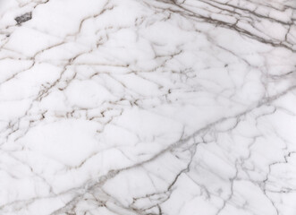 A white marble stone surface, slightly dirty and used, with dark light veins. Useful texture or backdrop.

