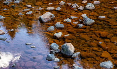 Water running down the river around rocks. Located near Seymour Lake, North Vancouver, British Columbia, Canada.