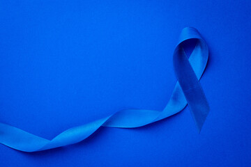 Blue ribbon cancer. Awareness of men health in November with blue prostate cancer ribbon isolated...