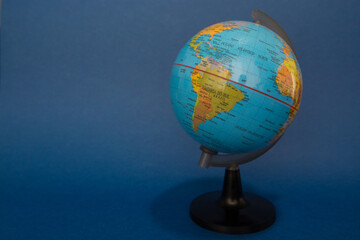 Globe isolated on a blue background.